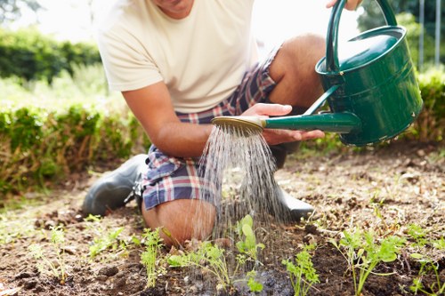 Operator wearing PPE while mowing a residential lawn